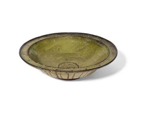 ArtChart | A large incised pottery green glazed bowl, Syria or Iran, 12th century by Unknown Artist